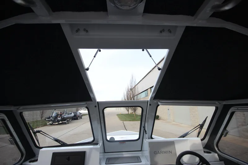 Slide: The Image of Interior view of 2025 Weldcraft 240 Maverick DV boat with Garmin navigation system. - 29