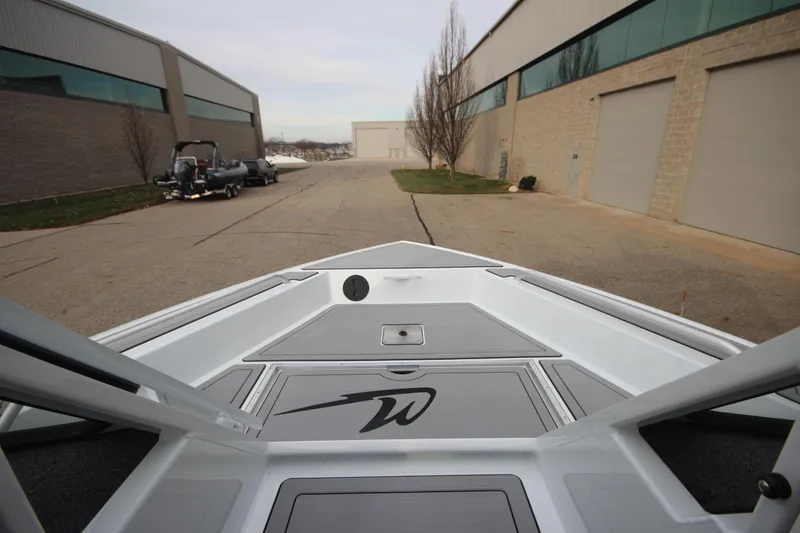 Slide: The Image of 2025 Weldcraft 240 Maverick DV boat in stock, parked outside industrial buildings. - 31