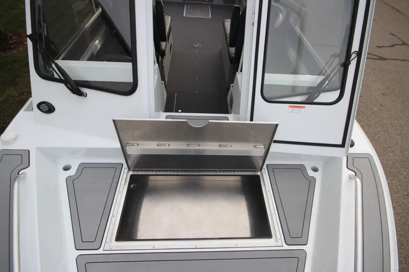 Slide: The Image of 2025 Weldcraft 240 Maverick DV boat with open storage compartment on deck. - 33