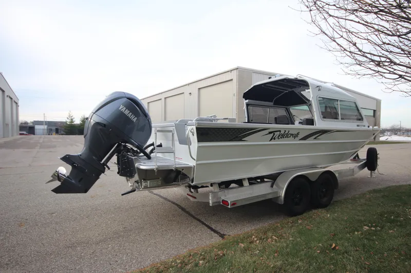 Slide: The Image of 2025 Weldcraft 240 Maverick DV boat with Yamaha engine on trailer, parked outdoors. - 6