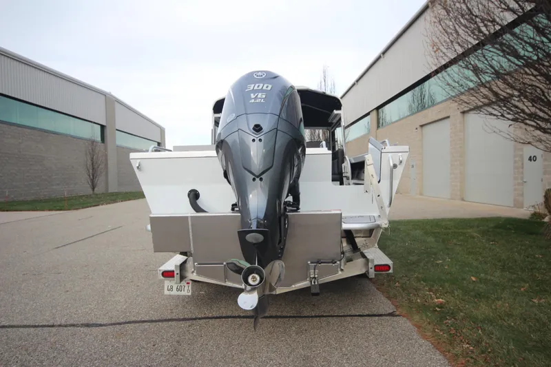 Slide: The Image of 2025 Weldcraft 240 Maverick DV boat with powerful outboard motor, parked outdoors. - 7