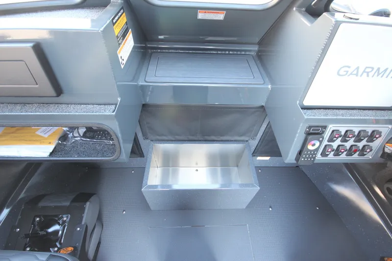 Slide: The Image of Interior of 2027 Weldcraft 240 Maverick DV boat with control panel and storage compartments. - 27