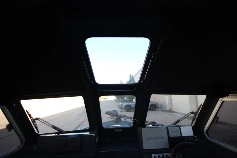 Slide: The Image of Interior view of 2027 Weldcraft 240 Maverick DV boat cockpit with Garmin navigation system. - 34