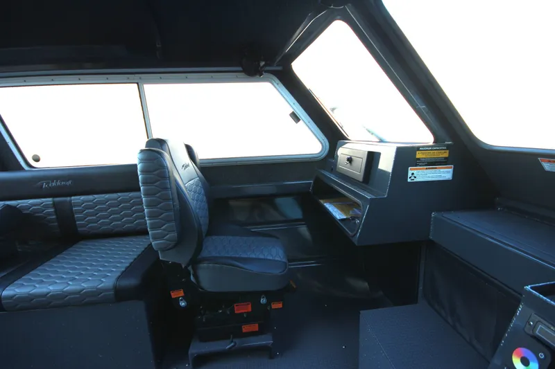 Slide: The Image of Interior of 2027 Weldcraft 240 Maverick DV boat with modern seating and dashboard. - 28