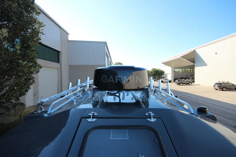 Slide: The Image of 2027 Weldcraft 240 Maverick DV boat with Garmin radar, parked near industrial buildings. - 41