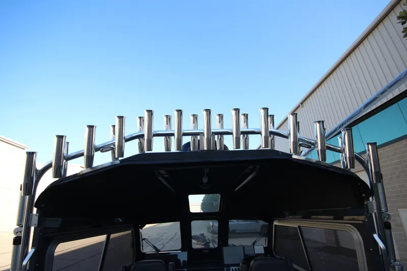 Slide: The Image of 2027 Weldcraft 240 Maverick DV boat with multiple rod holders, exterior view. - 21