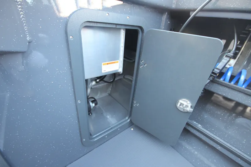 Slide: The Image of Open storage compartment on 2027 Weldcraft 240 Maverick DV boat, showcasing interior details. - 17