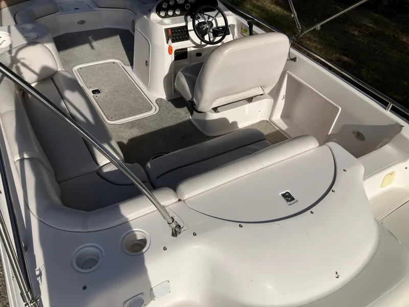 Slide: The Image of Interior of a 2004 Hurricane 201 GS boat with white seating. - 10