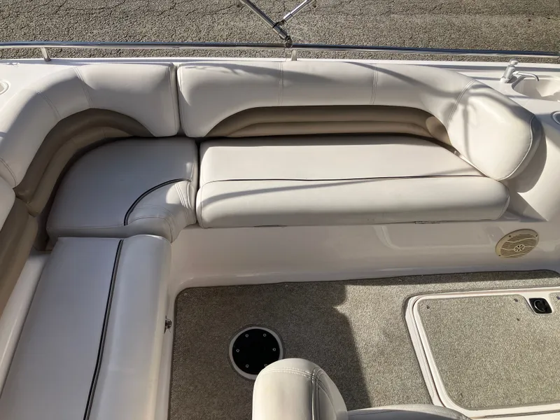 Slide: The Image of Interior of a 2004 Hurricane 201 GS boat with white upholstery. - 12