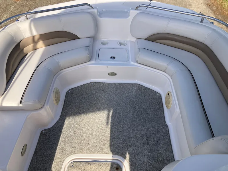 Slide: The Image of Interior of a 2004 Hurricane 201 GS boat with cushioned seating. - 15