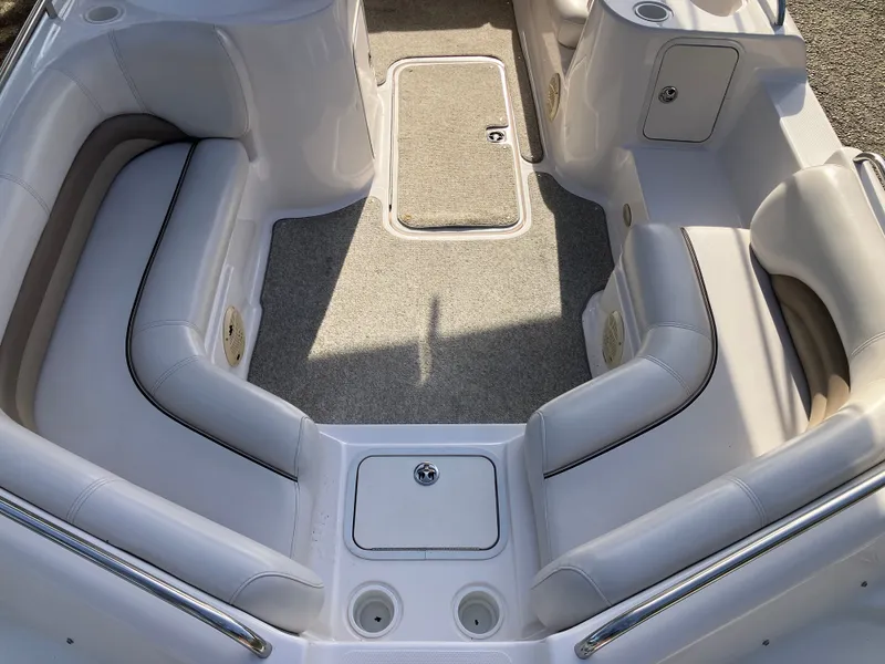 Slide: The Image of Interior of a 2004 Hurricane 201 GS boat with seating area. - 17