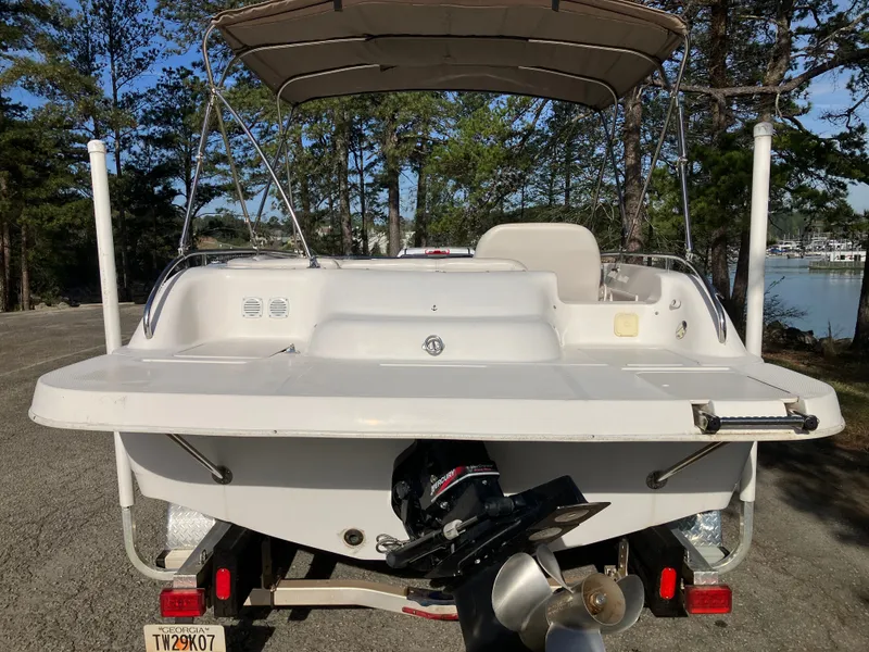 Slide: The Image of Rear view of a 2004 Hurricane 201 GS boat on a trailer. - 6