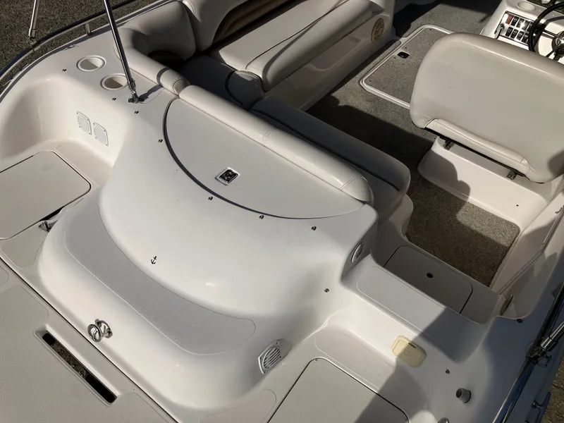 Slide: The Image of Interior of a 2004 Hurricane 201 GS boat, white upholstery. - 9