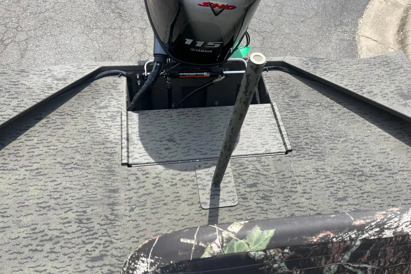 Slide: The Image of 2026 War Eagle 961 Blackhawk boat interior with Yamaha 115 engine, camo design. - 18