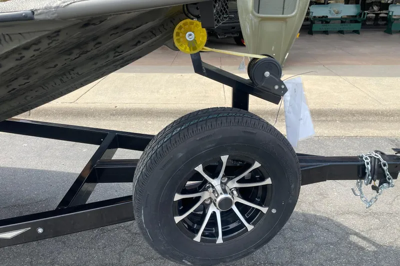 Slide: The Image of Trailer wheel and hitch of 2026 War Eagle 961 Blackhawk boat. - 3