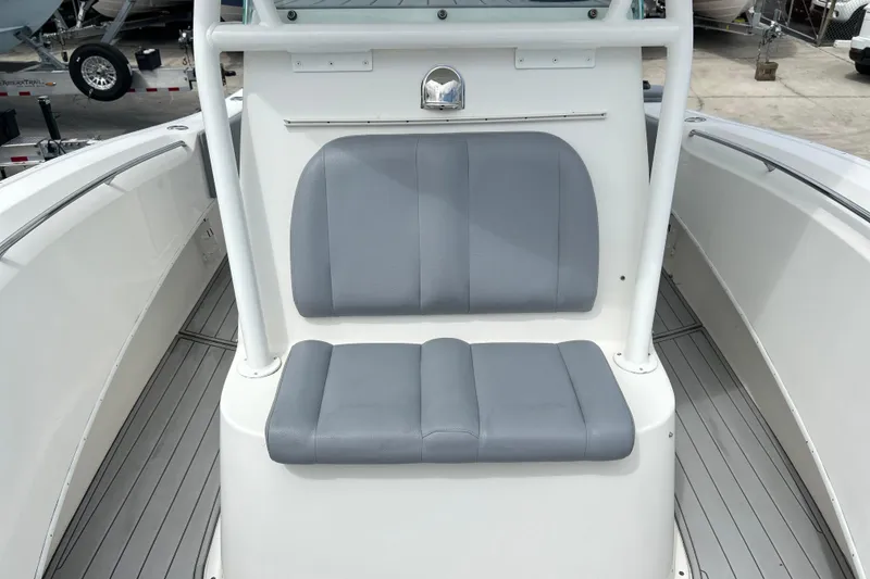 Slide: The Image of 2015 Cape Horn 32 XS boat with gray cushioned seating and sleek white interior. - 13