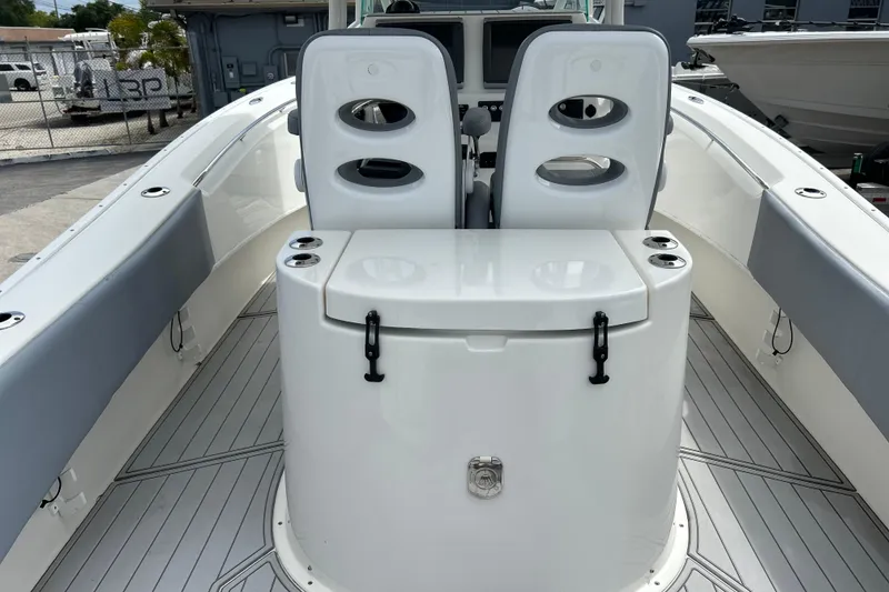 Slide: The Image of 2015 Cape Horn 32 XS boat interior with dual seats and storage compartment. - 15