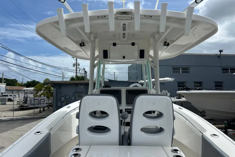 Slide: The Image of 2015 Cape Horn 32 XS boat interior with dual seats and overhead rod holders. - 19