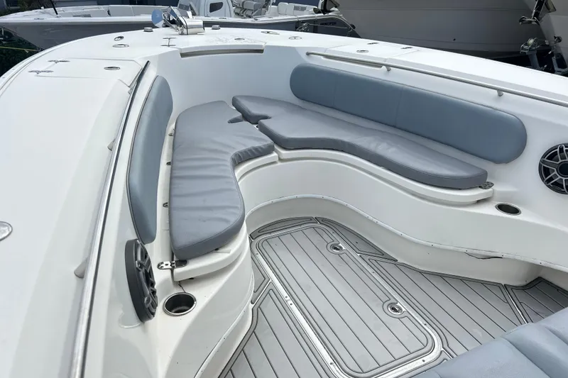 Slide: The Image of 2015 Cape Horn 32 XS boat interior with cushioned seating and cup holders. - 20