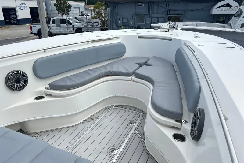 Slide: The Image of 2015 Cape Horn 32 XS boat interior with cushioned seating and speakers. - 21
