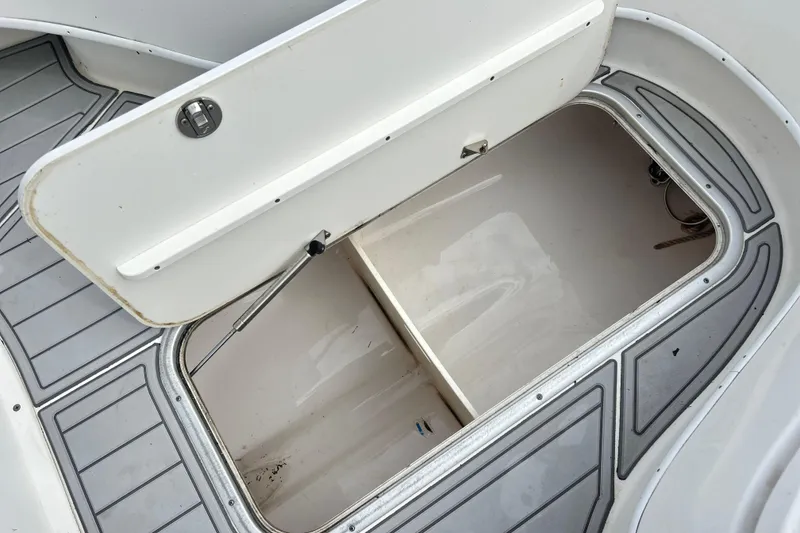 Slide: The Image of Open storage compartment on a 2015 Cape Horn 32 XS boat deck. - 23