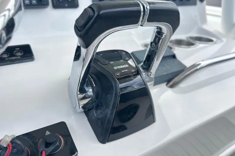 Slide: The Image of Close-up of Yamaha throttle controls on a 2015 Cape Horn 32 XS boat. - 25
