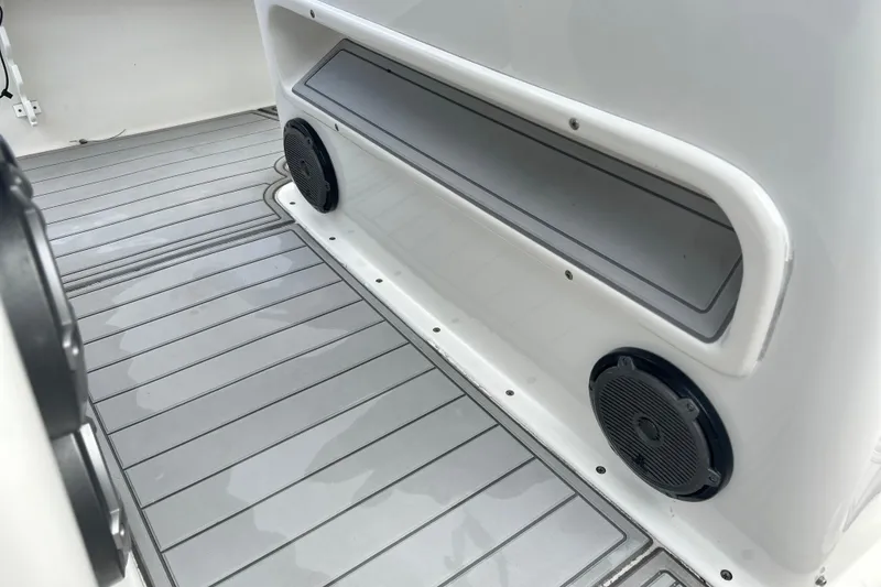 Slide: The Image of Interior view of a 2015 Cape Horn 32 XS boat, featuring speakers and storage compartment. - 27