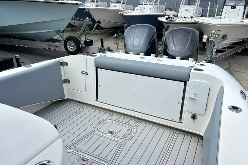 Slide: The Image of 2015 Cape Horn 32 XS boat interior with dual outboard motors and spacious deck. - 3