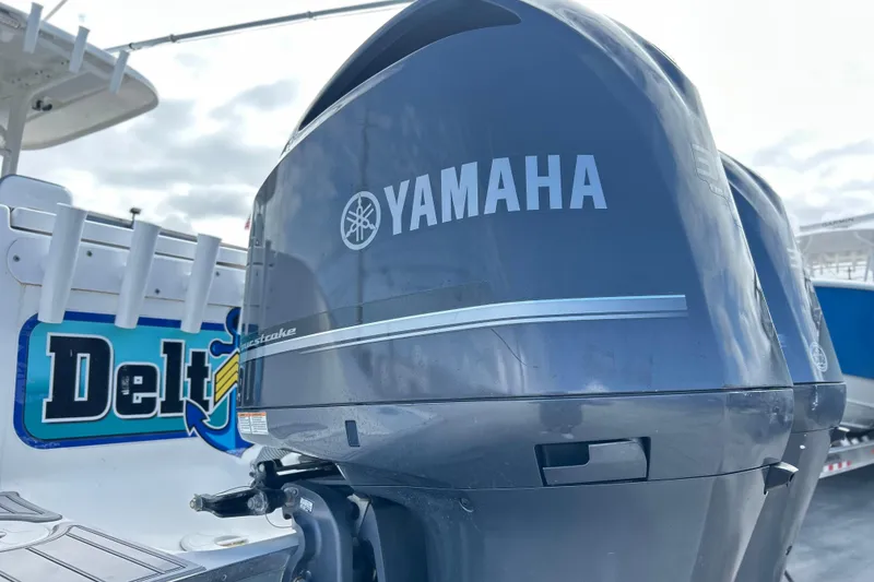 Slide: The Image of Yamaha outboard motor on 2015 Cape Horn 32 XS boat, featuring Delta logo. - 32