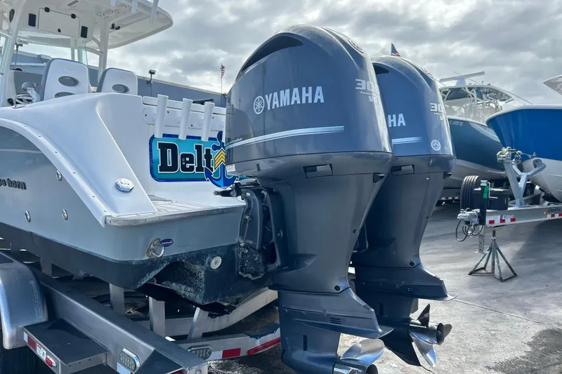 Slide: The Image of 2015 Cape Horn 32 XS boat with dual Yamaha 300 outboard engines on a trailer. - 33