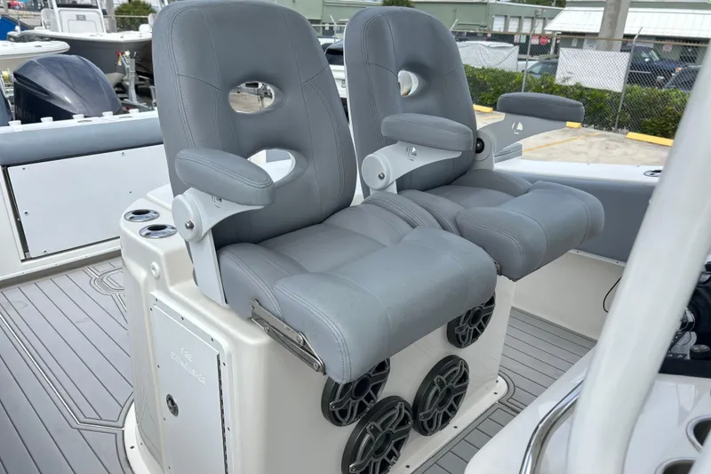 Slide: The Image of 2015 Cape Horn 32 XS boat with dual gray captain's chairs and speakers. - 7