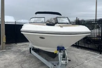Slide: The Image of 2022 Bayliner VR6 Bowrider OB on trailer, parked outdoors, front view. - 3
