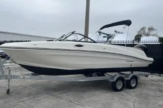 Slide: The Image of 2022 Bayliner VR6 Bowrider OB on trailer, sleek design, outdoor setting. - 5