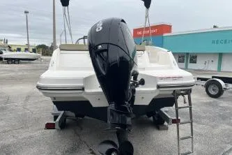 Slide: The Image of 2022 Bayliner VR6 Bowrider OB with outboard motor, parked on a trailer. - 6