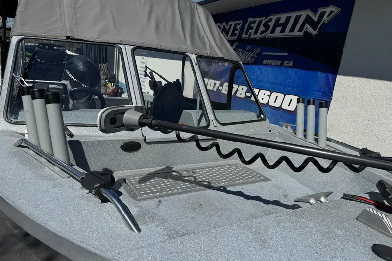 Slide: The Image of 2008 Jetcraft 1925 Adventurer boat with fishing rod holders and canopy. - 11