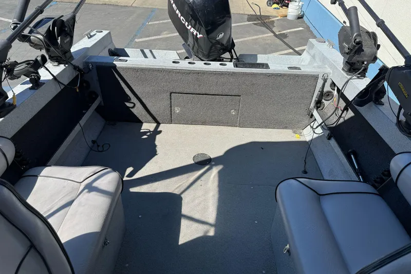 Slide: The Image of Interior of a 2008 Jetcraft 1925 Adventurer boat with seating and fishing equipment. - 16