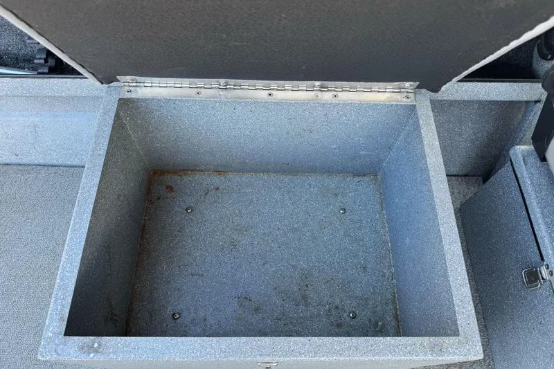 Slide: The Image of Open storage compartment in a 2008 Jetcraft 1925 Adventurer boat. - 17