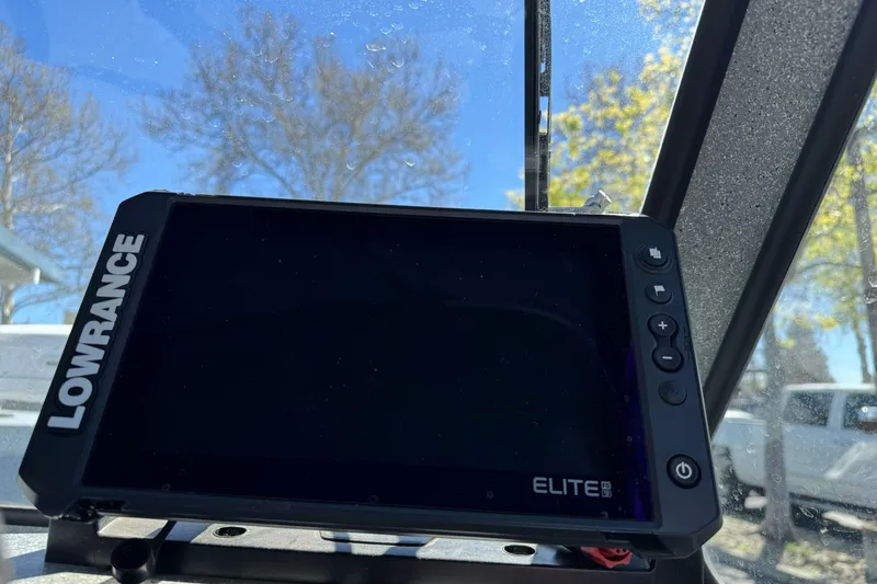 Slide: The Image of Lowrance Elite fishfinder on 2008 Jetcraft 1925 Adventurer boat, with trees visible through windshield. - 21