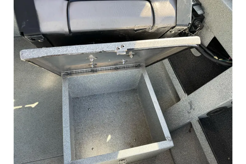 Slide: The Image of Open storage compartment in a 2008 Jetcraft 1925 Adventurer boat interior. - 24