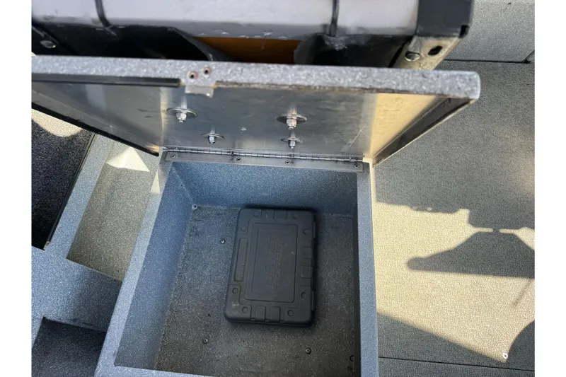Slide: The Image of Open storage compartment in 2008 Jetcraft 1925 Adventurer boat, showing interior details. - 25