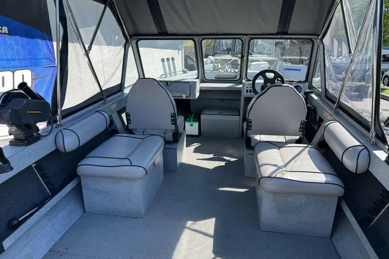 Slide: The Image of Interior of a 2008 Jetcraft 1925 Adventurer boat with seating and steering console. - 8