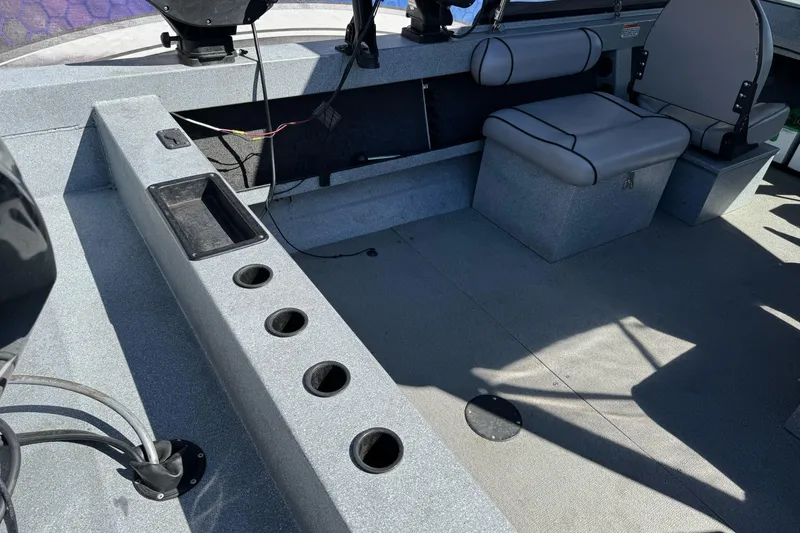 Slide: The Image of Interior of a 2008 Jetcraft 1925 Adventurer boat with seating and storage compartments. - 9