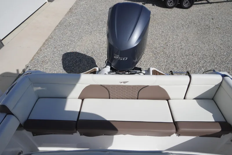 Slide: The Image of 2024 Tidewater 232 LXF boat with Yamaha 250 engine and cushioned seating. - 18