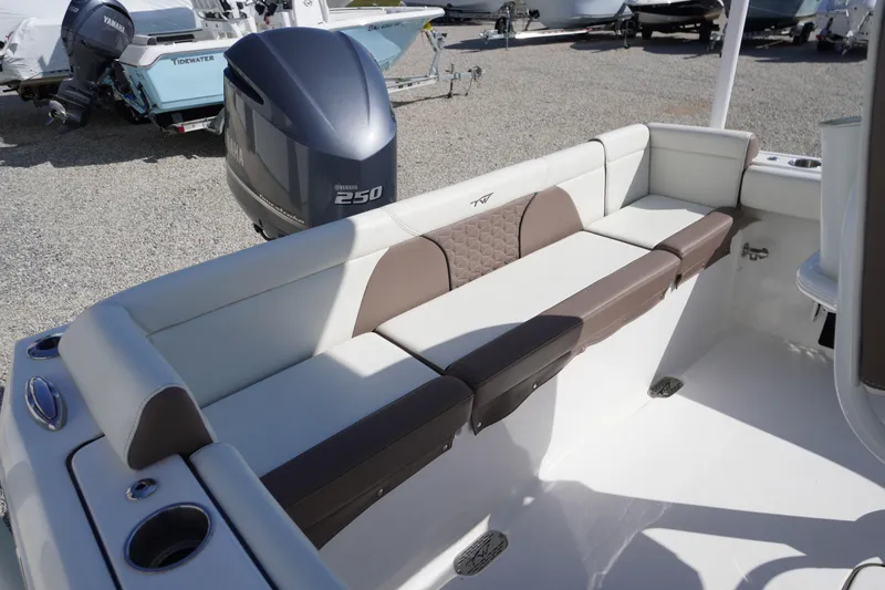 Slide: The Image of 2024 Tidewater 232 LXF boat interior with Yamaha 250 engine, featuring comfortable seating. - 19