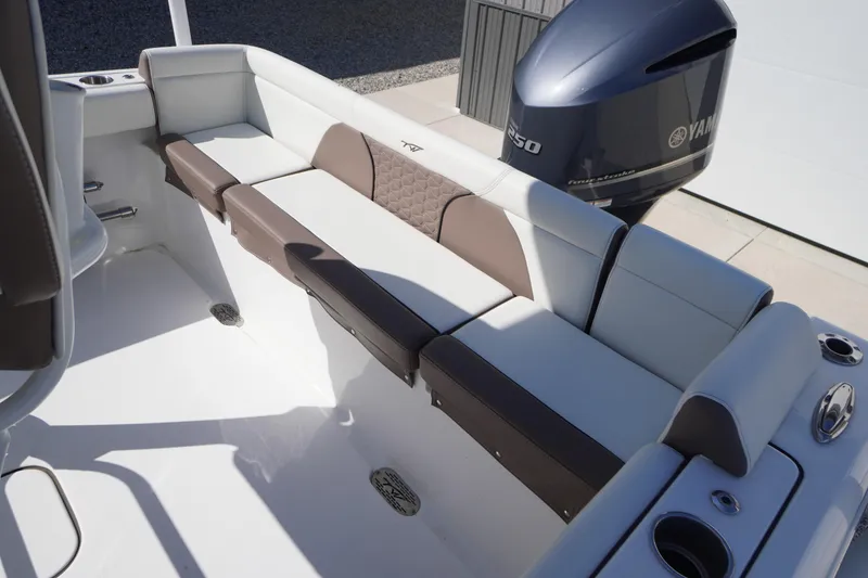 Slide: The Image of 2024 Tidewater 232 LXF boat interior with Yamaha engine, featuring comfortable seating. - 21