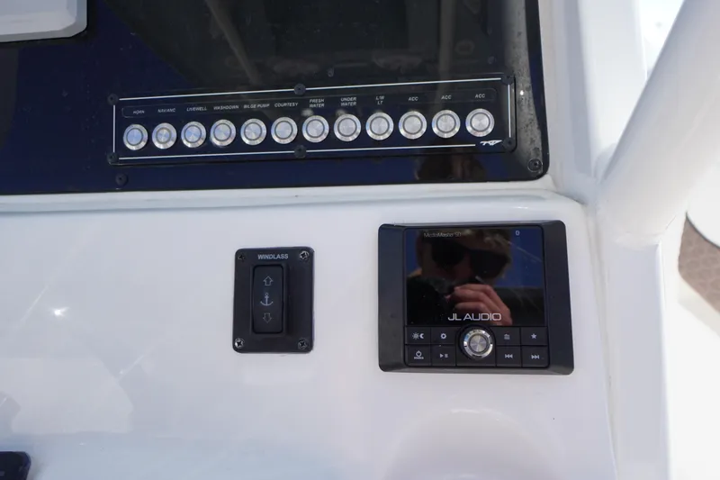 Slide: The Image of Control panel of 2024 Tidewater 232 LXF boat with JL Audio system. - 32
