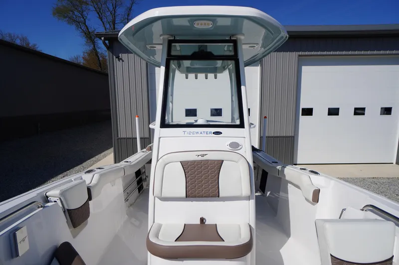 Slide: The Image of 2024 Tidewater 232 LXF boat interior with modern seating and console design. - 36