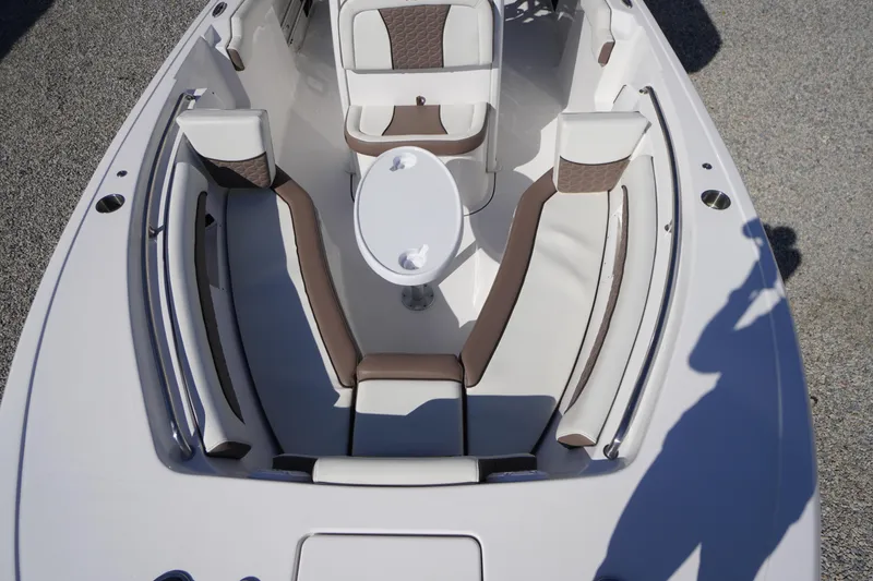 Slide: The Image of 2024 Tidewater 232 LXF boat interior with seating and table, viewed from above. - 40