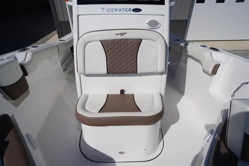 Slide: The Image of 2024 Tidewater 232 LXF boat interior with cushioned seating and modern design. - 45