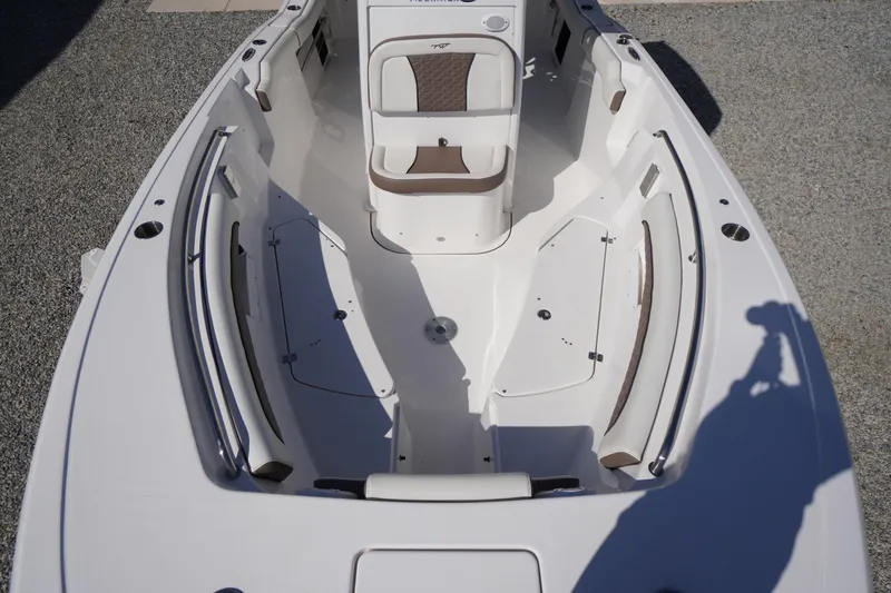 Slide: The Image of 2024 Tidewater 232 LXF boat interior with seating and storage compartments. - 52